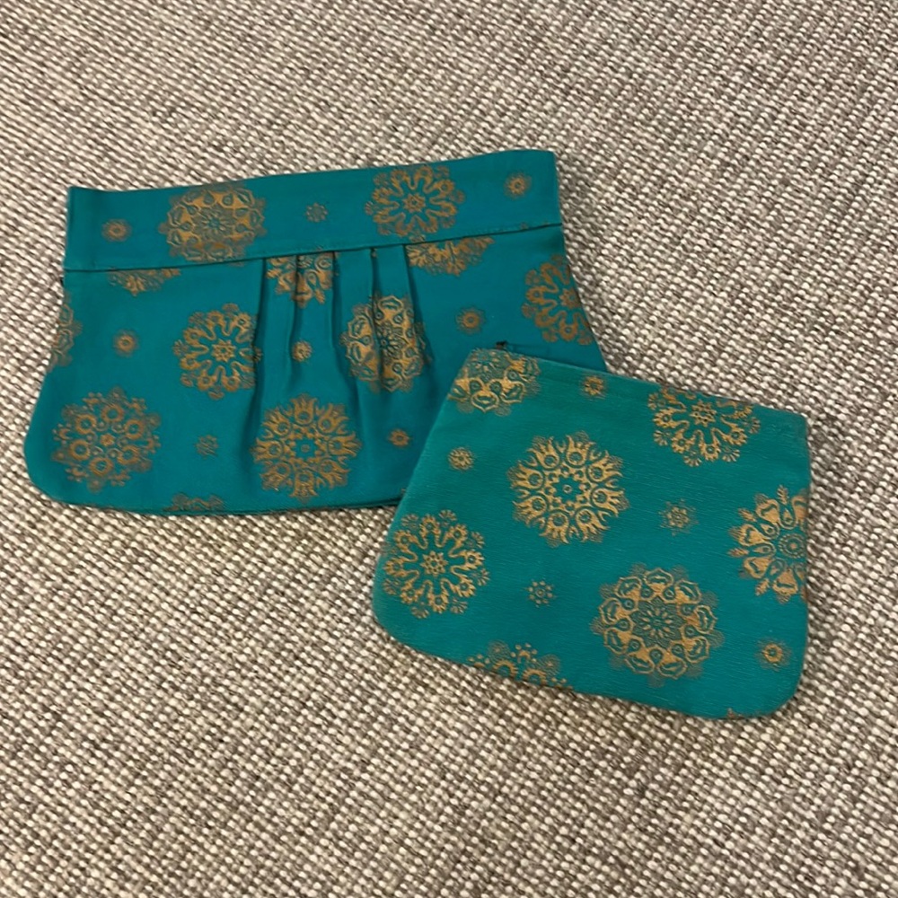 Matta clutch and extra bag.    Matching blue and gold
